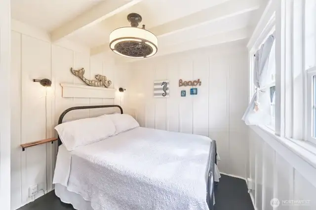 Cozy bedroom with painted fir floors