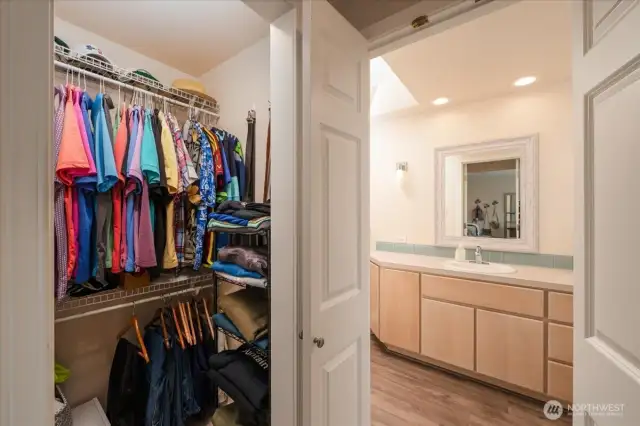 Matching closets on either side of the primary bathroom entrance.
