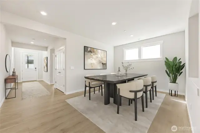Well-lit entry, and formal dining area - virtually staged.