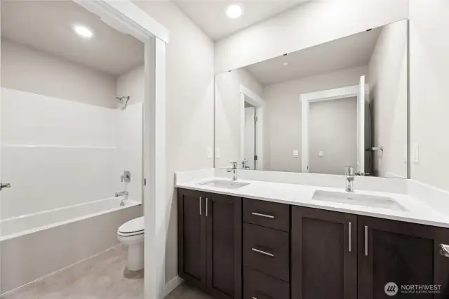 Upstairs bath, vanity with dual sinks.