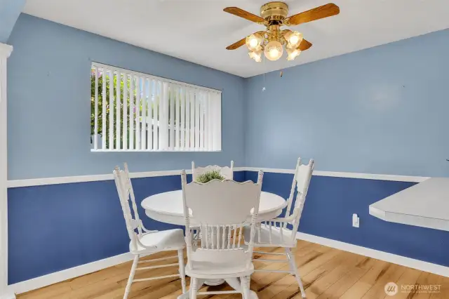 Dining room with ceiling fan.