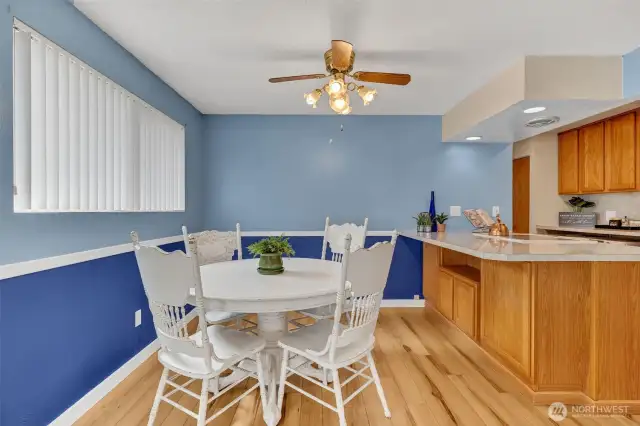 Dining room with ceiling fan.