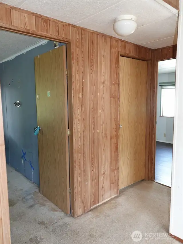Hallway on the other side of the house leading to the 3 guest bedrooms and 3/4-bath.