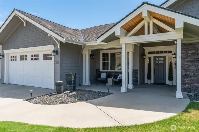 Welcoming entry with wood & stone accents