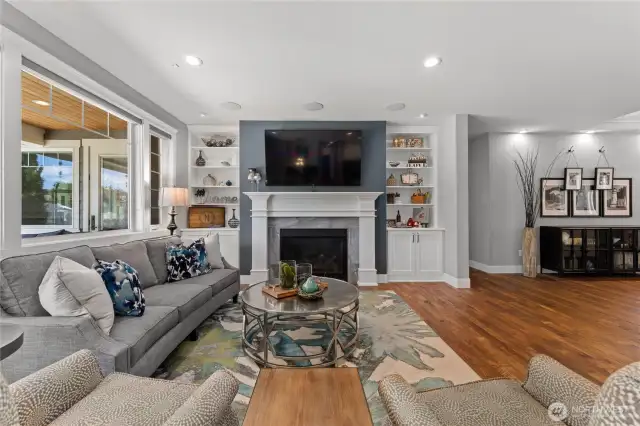 Welcoming great room open to dining area and kitchen. Beautiful engineered hardwood flooring