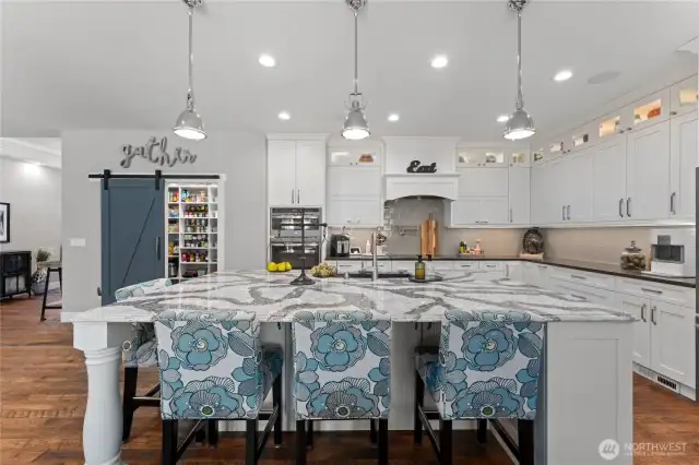 Oversized kitchen island with quartz counters, island seating, great for entertaining!