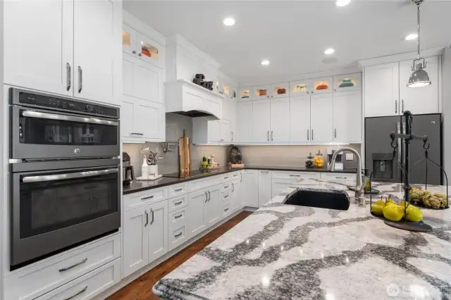 Blanco kitchen sink, tons of prep & serve space, with Sonos sound system wired throughout home