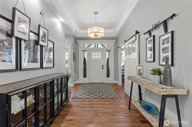 Welcoming entry hallway with the office and guest bedroom 1 located at front of home