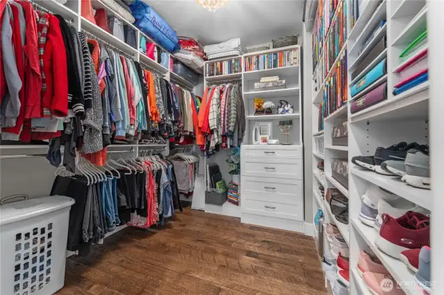 Primary bedroom walk-in closet with built-ins.