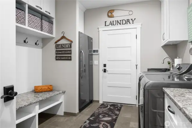 Laundry/Utility/Mud Room with sink, freezer and built-ins