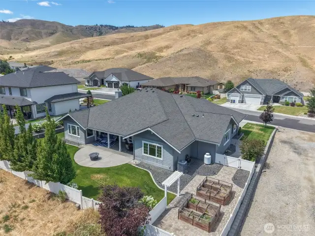 Fully fenced backyard with grass, gas plumbed to patio for BBQ, irrigation, mature trees.