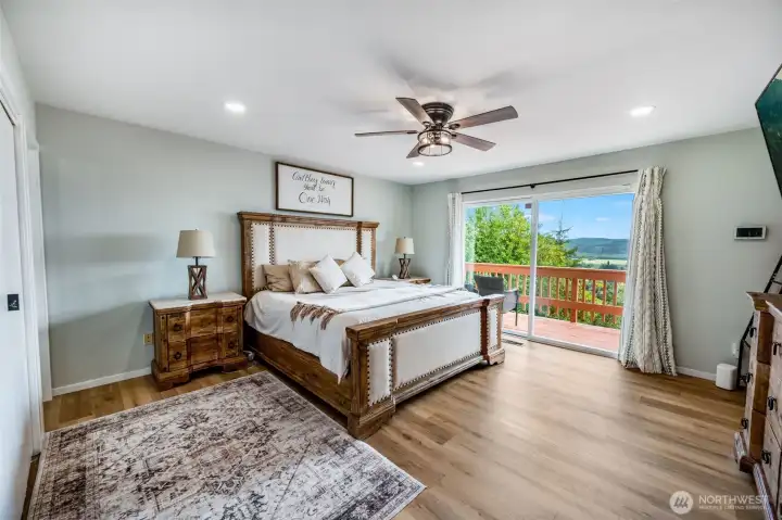 Primary bedroom with view and deck