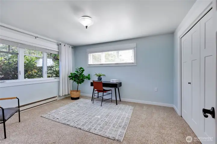Down the hall to spacious second bedroom.