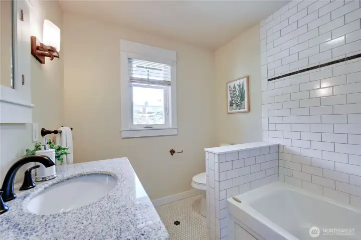 Bathroom off second bedroom.  Jetted tub with shower.