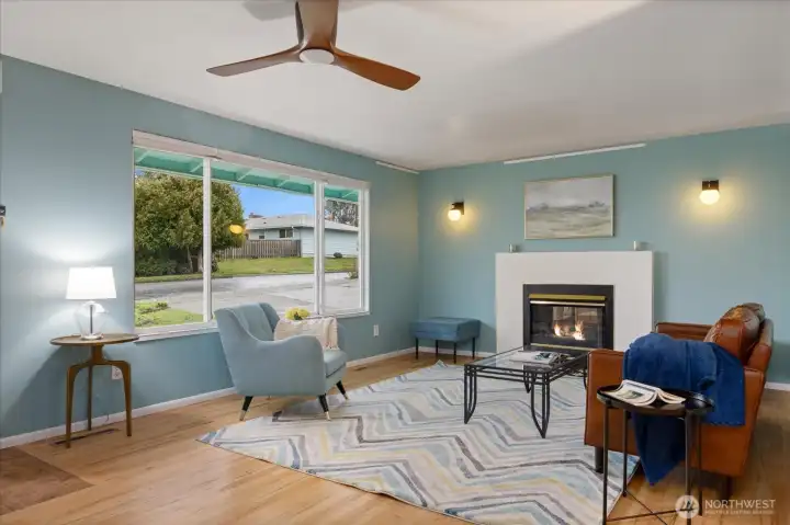 Upon entering, you're greeted with a beautiful living room that begs to be adorned with loved ones. Picture hangers are throughout the house, which make hanging your beloved art a breeze.