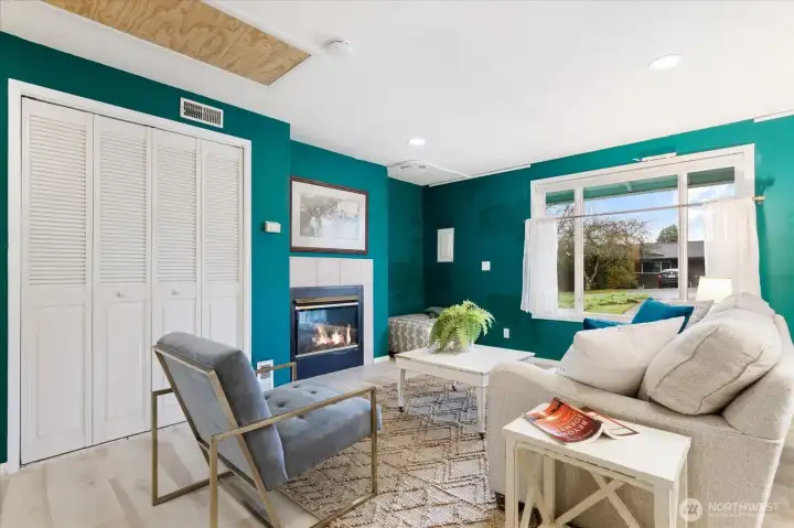 The electric view-through fireplace provides ambiance and warmth.