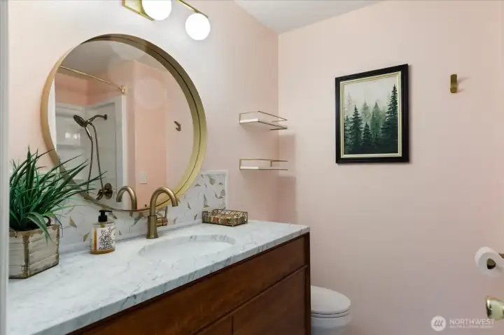 Heading back through the house, the hall bath with jetted tub & ample vanity