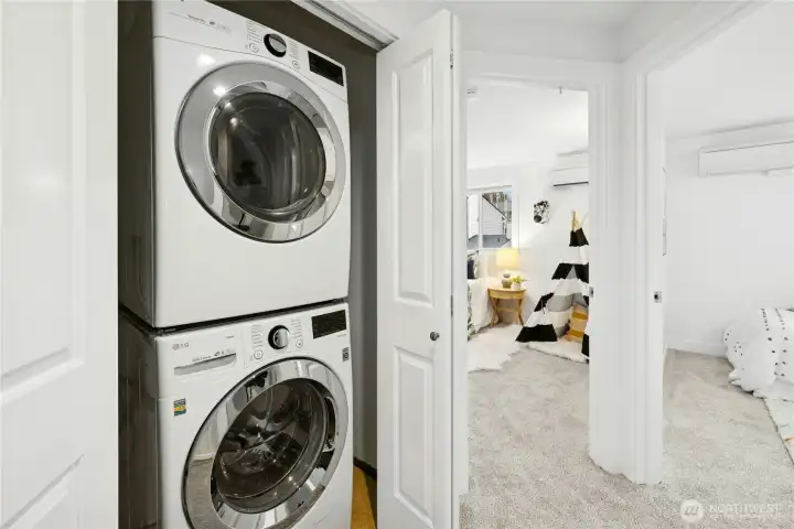 Full sized washer and dryer in upstairs closet.