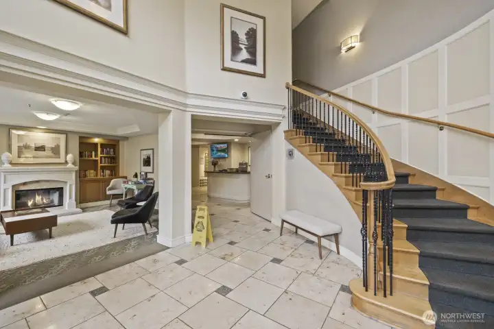 The welcoming entryway of the community includes a lounge and the helpful concierge here for your every need.