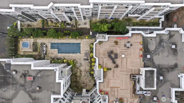 Aerial view of the central courtyard, patio, pool area and rooftop deck - what a luxury to have access to so much great outdoor space!
