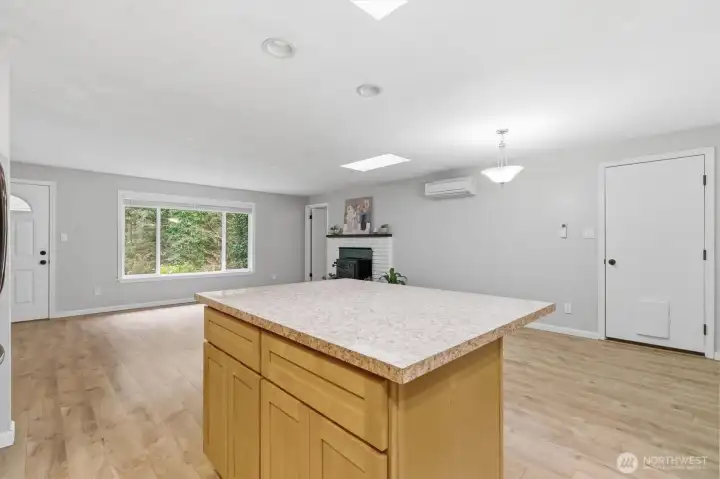 Kitchen island open to living room and dining room