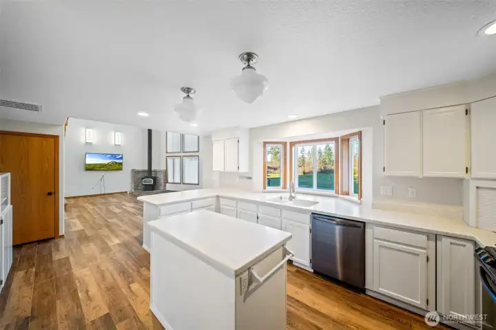 The heart of the home! Newer appliances all stay with the home. Nice center island makes a terrific work station or serving area