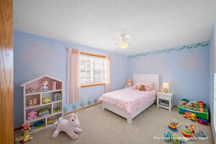 Main floor front bedroom, virtually staged