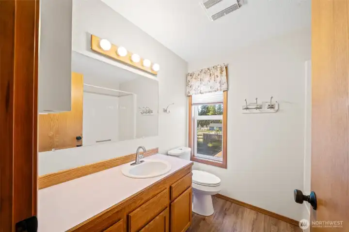 Ensuite full bath with LVP floors and plenty of counter and cabinet space