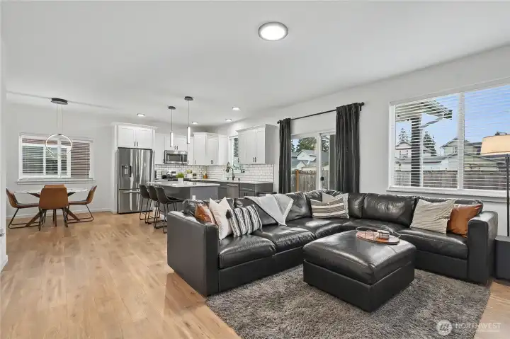 Nice view of your open-concept living, large patio doors leading to your covered patio and private back yard.