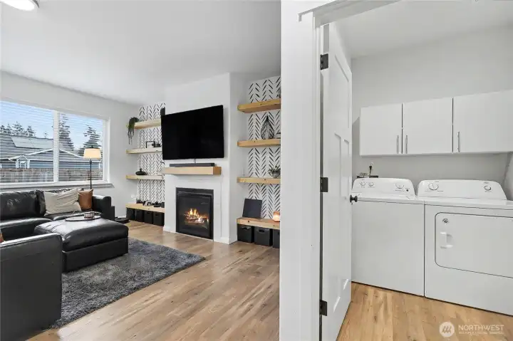 View of your utility room off of the family room, Sellers added handy storage cabinets above.