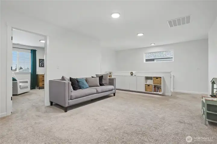 As you head upstairs, you will find this HUGE loft with built-ins, perfect for a 2nd entertaining space, office, kids play area, media room, or??