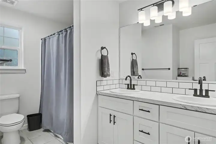 Upstairs kids/guest full bath, double vanity!