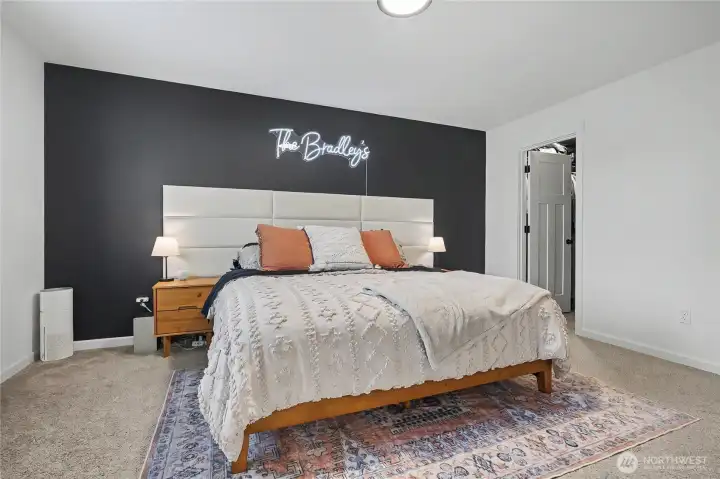 Upstairs Primary  view, walk-in closet to your right, I love the size and dramatic accent wall!