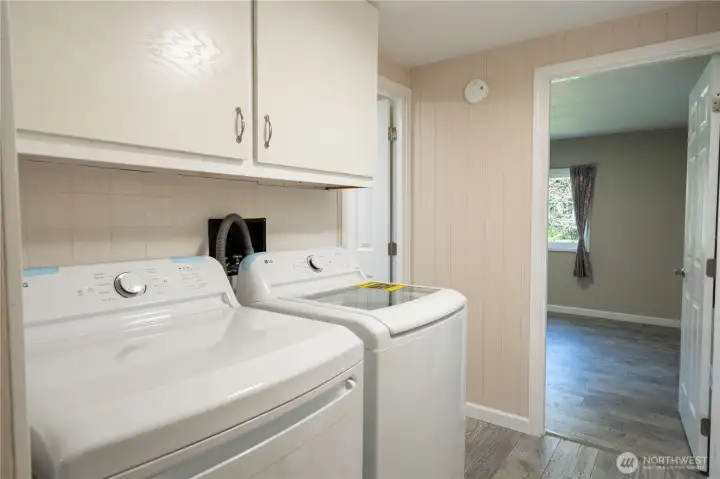 Laundry located next to Full Bathroom