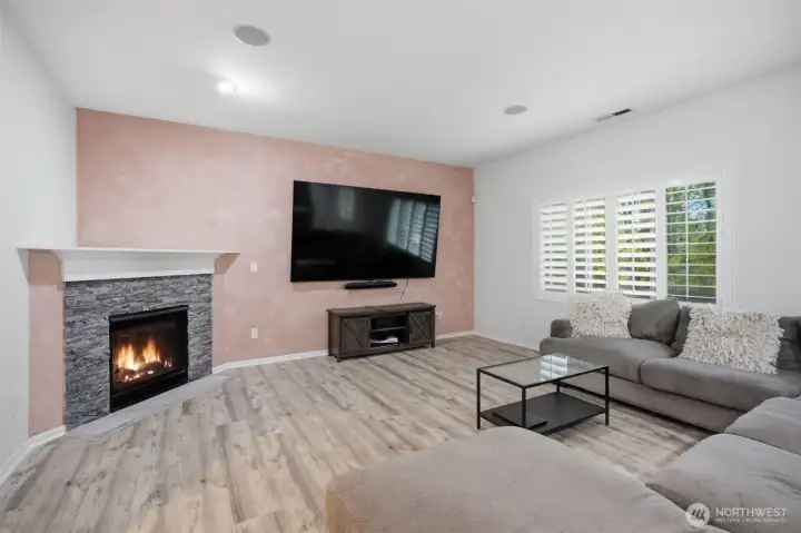 Living room showcasing a beautiful fireplace and an ideal layout for everyday living.