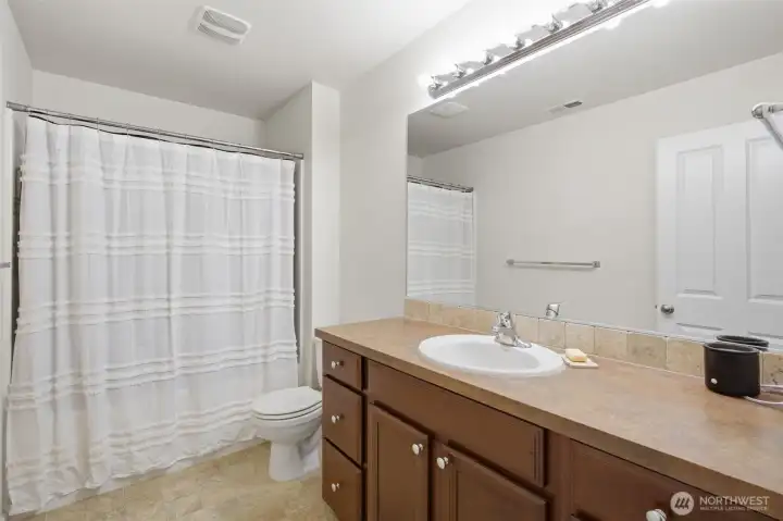 Second full bathroom showcasing a clean design and efficient layout.