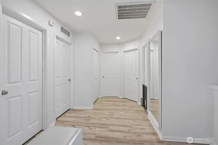 Well-designed upstairs hallway linking the bedrooms, laundry area, 2nd full bathrooms, and additional linen storage.