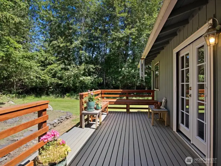 Private deck borders green space