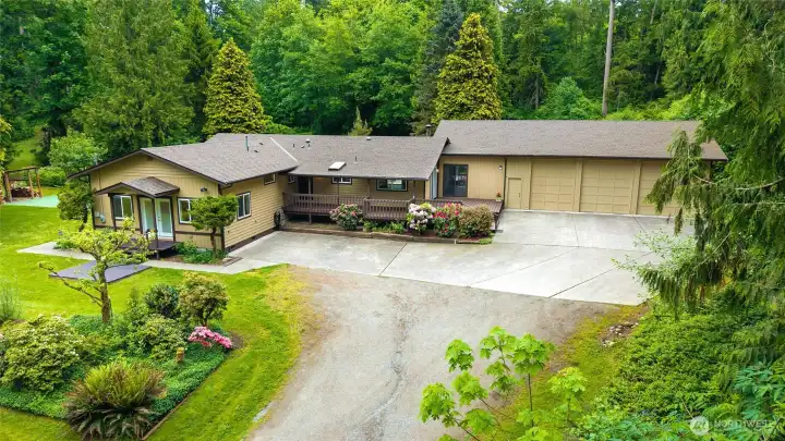 Main home in the middle, large shop on the right, and separate entrance on the left for the bonus/ADU space. Perfect home for potential rental income or multi-generational living.