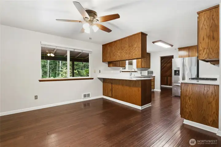 Dining room with additional kitchen eating space.