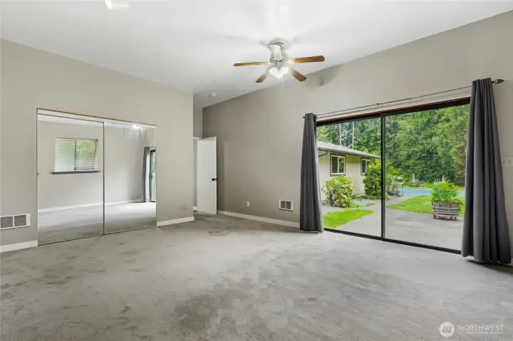Primary Bedroom with slider to the backyard.