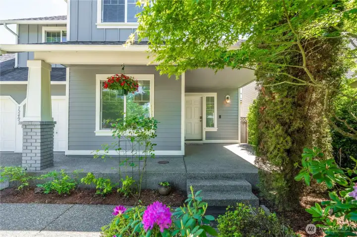 Inviting covered front entry with charming curb appeal