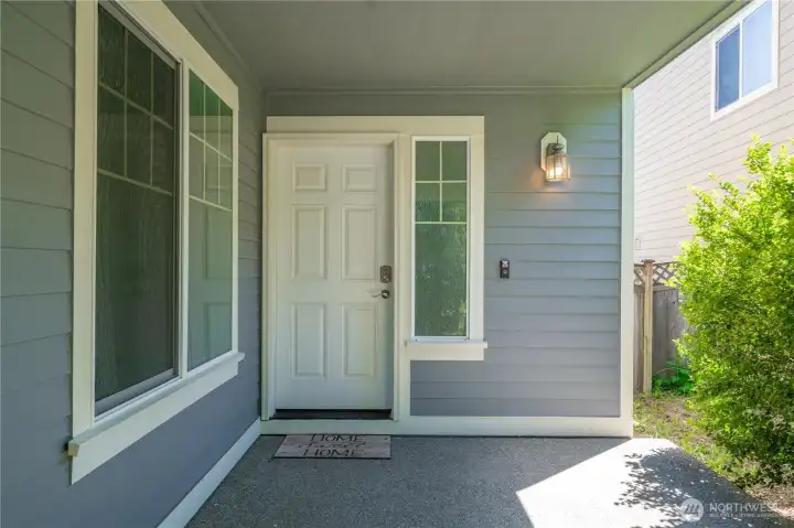 Welcoming covered front porch with space for a cozy seating arrangement