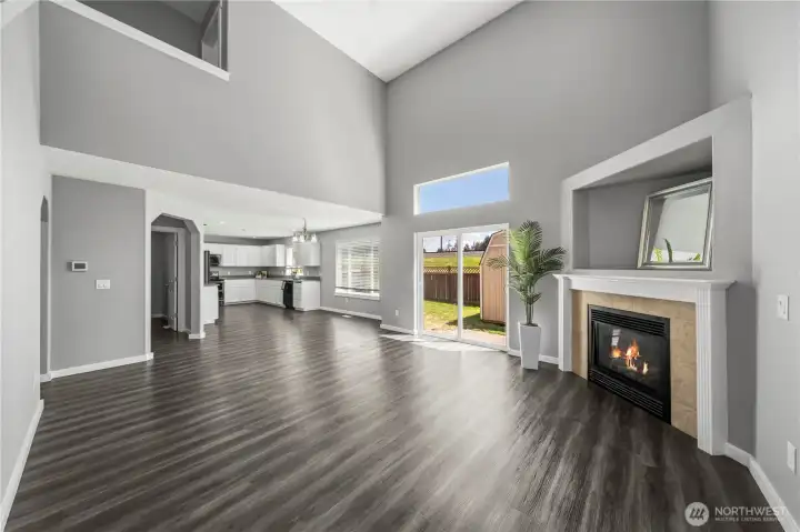 Spacious open-concept living area filled with natural light and modern finishes
