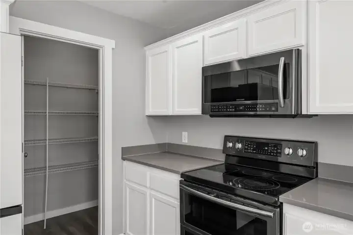 Kitchen area featuring a very large walk-in pantry for exceptional storage space
