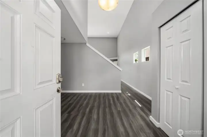 Welcoming front entry area with convenient layout and coat closet
