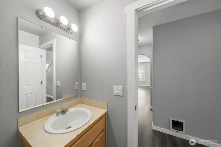 Convenient downstairs half bath with modern finishes