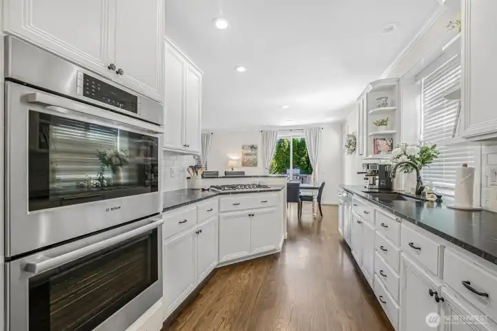 Updated cabinetry and counters throughout the kitchen.