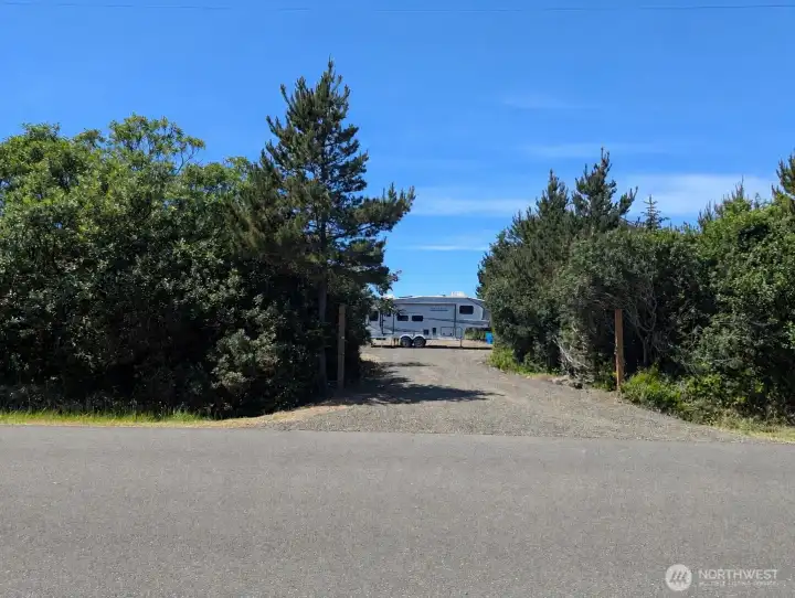 Private oceanfront lot has the gravel driveway and all utilities in