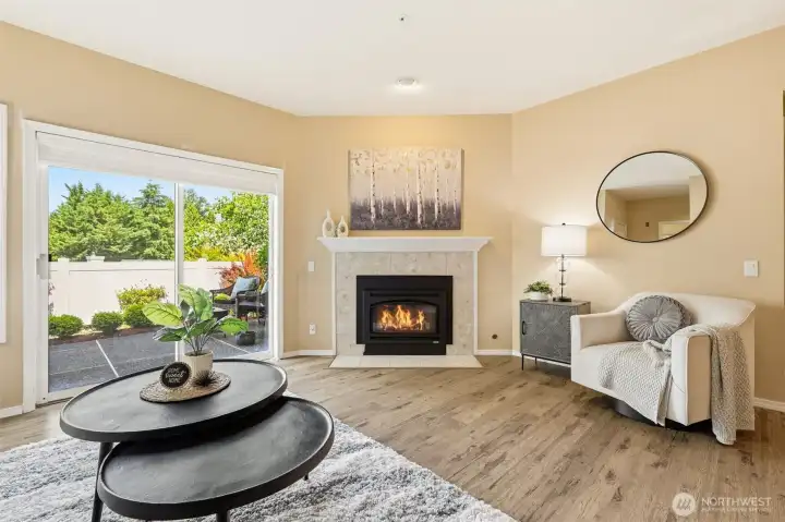 Inviting living room with cozy gas fireplace and sliding door to the private patio. Inviting living room with cozy gas fireplace and sliding door to the private patio.
